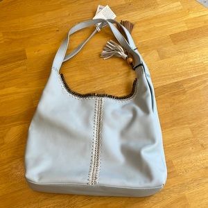 New. Genuine leather blue purse with price tag.